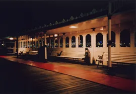 Nighttime photo of seating on Brighton Pier