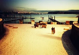 Photo of a snowy Cardiff Bay, looking across the Bay at sunset